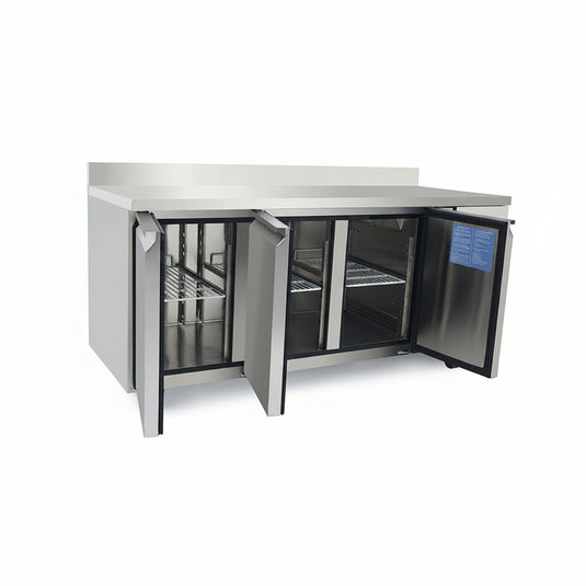Stainless steel kitchen counter with open doors on a white background