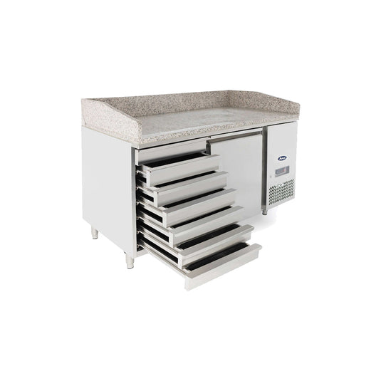 Commercial refrigerator with granite countertop on a white background